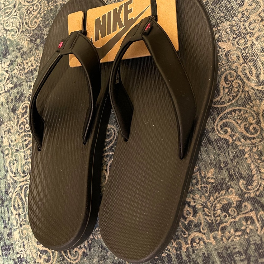 Nike Flip Flips pink symbol